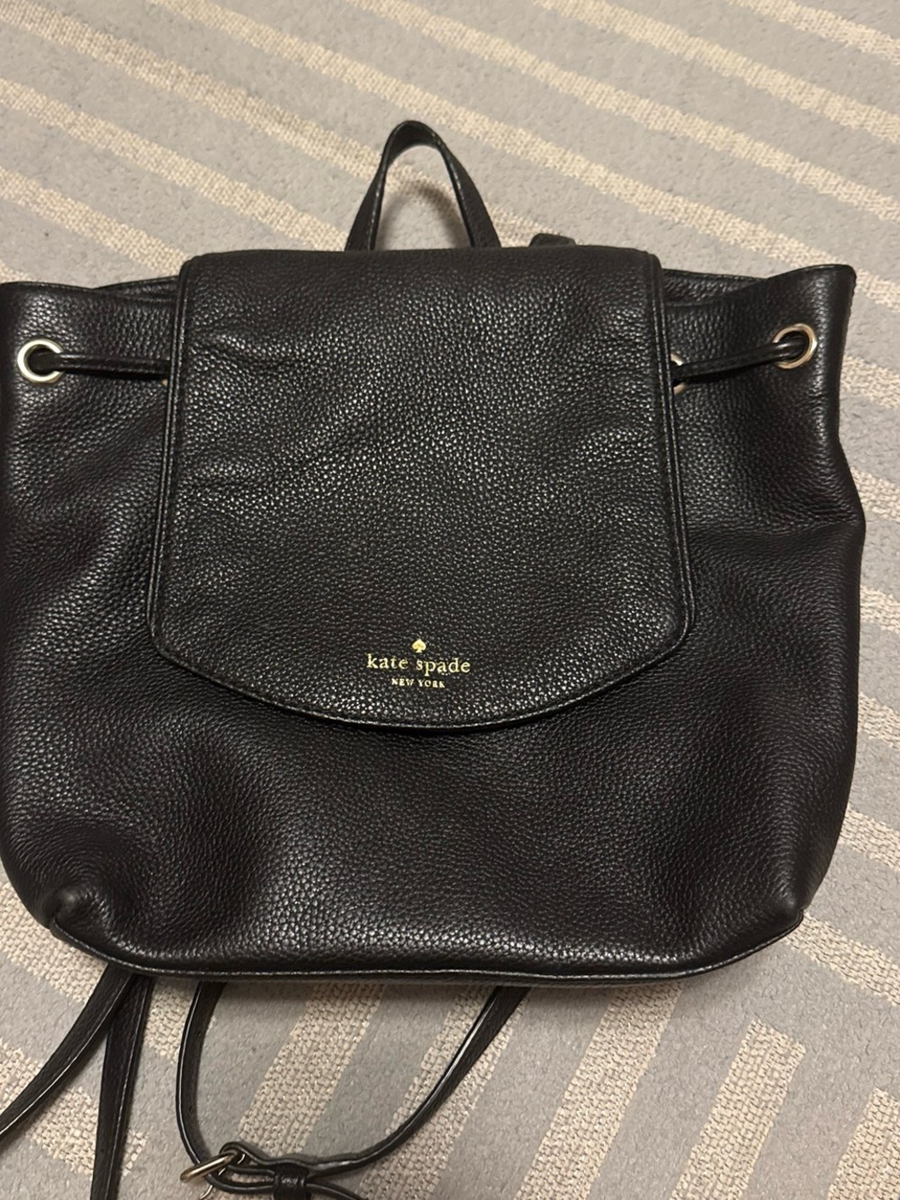 kate spade black pebbled leather flap drawstring backpack